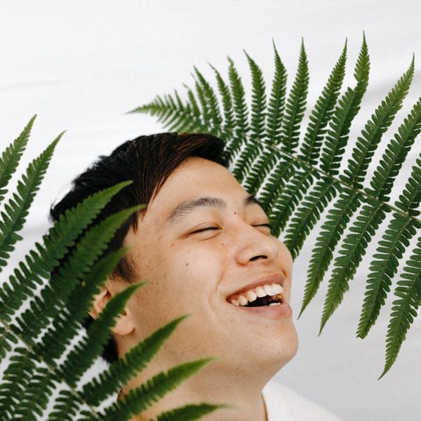 Person meditating peacefully in a bright, clean environment.